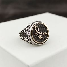 The ring is made of 925 sterling silver with fine workmanship. Planets, stars and comets are embroidered on the sides of the ring. PRODUCT FEATURES * Mineral Production: 925 Sterling Silver, Bronze * Weight: 13.5 grams * Ring Diameter: 18 mm Scorpio on the ring, sun, moon and star embroideries are made on the sides. The ring can be changed upon request. * Ready to Ship in 1-3 Business Days * Shipped within 1-3 business days worldwide with free express shipping. * The product will be sent to you Scorpio Rings Jewelry, Scorpio Ring, Scorpio Jewelry, Astrology Jewelry, Judaica Jewelry, Scorpio Horoscope, Zodiac Rings, Masonic Ring, Star Embroidery