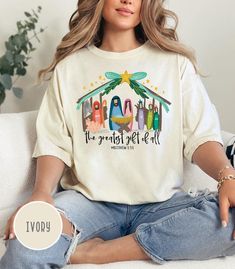 This Cute Nativity Scene T-shirt featuring The Greatest Gift of All is perfect for celebrating Christmas in a Christian way. The design exudes a warm and festive vibe, making it a great addition to your holiday wardrobe. It's relevant to those who celebrate Christmas and want to showcase their faith during the holiday season. Product features - Available in sizes S to 2XL for the perfect fit - Double-needle stitching for durability - Garment-dyed fabric for a soft texture - Made with high-qualit Christian Christmas Gift, The Greatest Gift, Bible Verse Shirt, Celebrating Christmas, Jesus Shirt, Religious Christmas, Christian Christmas, Holiday Wardrobe, Celebrate Christmas