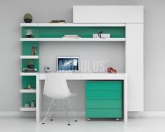 a desk with a computer on top of it in front of a green bookcase