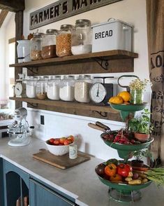 a kitchen with shelves filled with lots of food on top of it and an instagramr