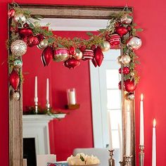 a table topped with a mirror and christmas decorations