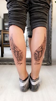 the legs and ankles of a woman with tattoos on them