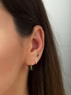 "** This listing is for the emerald stud earrings (as seen in the 2nd photo). Sold individually (1 stud) or as a pair (2 studs). These little emerald green baguette studs look beautiful with everything. An everyday staple piece, perfect for wearing in a second/third earhole or all by themselves for a dainty addition to your look. * D E T A I L S * ∙ Material: .925 Sterling Silver or 18K Gold Plated over .925 Sterling Silver ∙ Stone: Green zirconia stone ∙ Dimensions: 5mm x 2mm ∙ Come with butter Small Green Earring, Cheap Green Everyday Earrings, Silver Emerald Earrings, Small Emerald Earrings, Emerald Earring Stack, Cheap Everyday Green Earrings, Green Earring Stack, Gold And Green Earrings, Thirds Earrings