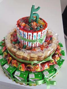 a birthday cake made out of candy and wrapped in plastic