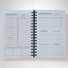 the daily planner is open and ready to be filled with notes or reminders on it