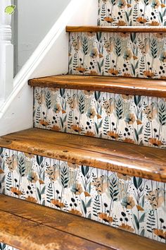 the stairs are decorated with floral wallpaper and wooden handrails, along with white painted stair risers