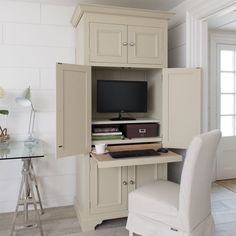 a desk with a computer on it and a chair in front of the monitor screen