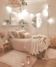 a bedroom with white walls and lights on the ceiling