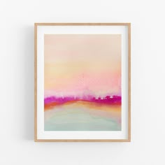 an abstract painting in pink, orange and blue on a white wall above a wooden frame