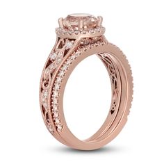 a rose gold engagement ring set with an oval center stone