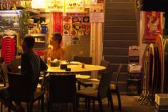 two people sitting at a table in a restaurant