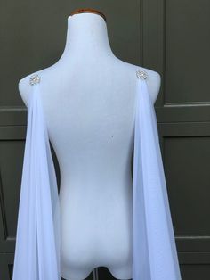 a white mannequin with a blue scarf on it