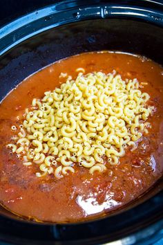 the noodles are being cooked in the slow cooker