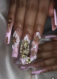 Latina Nails With Gems, Guadalupe Nail Designs, Dramatic Nail Sets, Bling Acrylic Nails With Initial, Virgin Mary Charm Nails, Pink Quinceanera Nails Long, Red San Judas Nails, Nails With San Judas, Traditional Mexican Nails