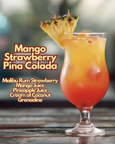 a close up of a drink in a glass on a table with the title mango strawberry pina cola