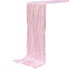 a pink scarf hanging from the side of a white wall