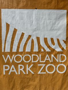 the woodland park zoo logo is on a brown paper bag