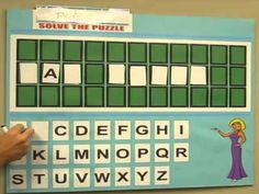 a person writing on a bulletin board with letters and numbers in front of them that spell out the word solve the puzzle