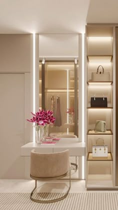 a room with a table, shelves and flowers in vases on the counter top