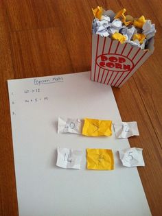 a paper bag and some yellow pieces of paper