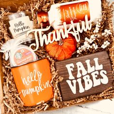 a gift box filled with coffee, pumpkins and other goodies for the thanksgiving season