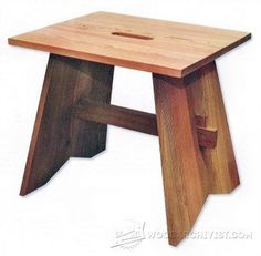 a small wooden stool that is made out of wood and has a hole in the middle