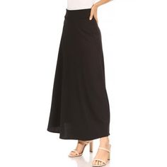 Product Description: The skirt flares out from the waist in an A-line shape, giving it a flowy and feminine look. It is made from a solid-colored fabric, adding versatility to the piece. The material is likely a lightweight and breathable fabric, perfect for warmer weather. Overall, this skirt is a great choice for a casual yet stylish outfit. It can be paired with a variety of tops and shoes to create different looks. The high waist and A-line shape are universally flattering, while the elastic waistband ensures comfort throughout the day. Approx Length: 38 in from waist to hem. Waist: 26 in Model is wearing a size small Size Chart(Inches) / HSK01785 L => Length: 39 / Waist: 29-30 M => Length: 38.5 / Waist: 27-28 S => Length: 38 / Waist: 25-26 1XL => Length: 39 / Waist: 30-32 2XL => Lengt Maxi Skirt Outfit For Work, Black Maxi Skirt Outfit For Work, Skirt Outfit For Work, Black Maxi Skirt Outfit, Ruffle Long Skirt, Short Pencil Skirt, Long Skirt Casual, Maxi Skirt Outfit, Bodycon Pencil Skirt