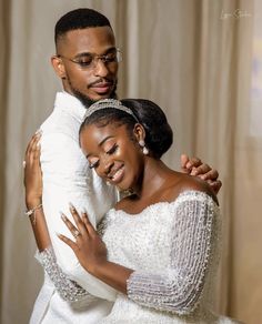 a man and woman hugging each other