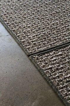 a close up view of an area rug on the floor