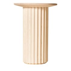 a round wooden table top with columns on it