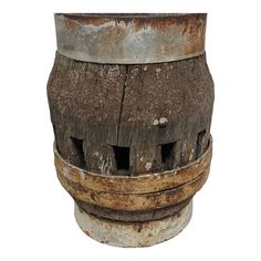 an old wooden barrel with rusted paint sitting on top of a white background,