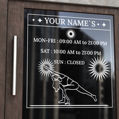 a glass sign on the front door of a building