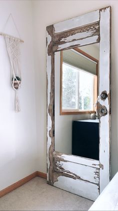 a mirror that is on the side of a wall