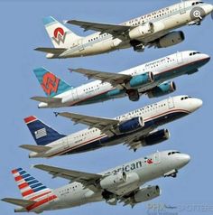 four airplanes are flying in the air with their landing gear down and one is upside down