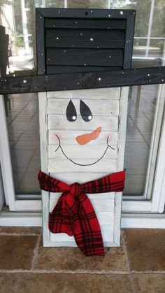 a snowman made out of an old door