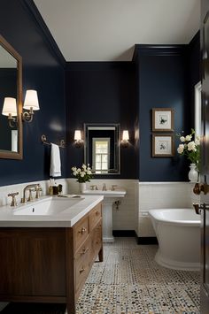 a bathroom with blue walls and white fixtures