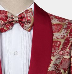 Indulge yourself with class, style, and sophistication when you don this burgundy and gold tuxedo at your next formal event. Whether your attending prom, your sister's wedding, or any formal gathering, this tux will make sure you get the right attention. Burgundy and gold form a mesmerizing pattern that doesn’t fail to impress you from the start – the colors swirl and overlap in a brilliantly picturesque manner. It is almost as if you are looking into a kaleidoscope consisting of gold and burgun Gold Tuxedo, Velvet Bow Tie, Velvet Loafers, Color Swirl, Tuxedo Suit, Burgundy And Gold, Sister Wedding, Velvet Bow, Suit Shop