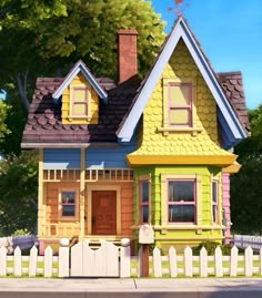 a yellow and blue house sitting on the side of a road next to a white picket fence