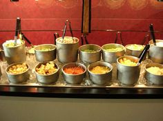 an assortment of food is displayed in buckets