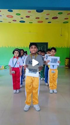 children in costumes holding up signs with words that read jump y'all over them