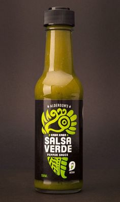 a bottle of salsa is shown on a dark background with space for the word salsa verde