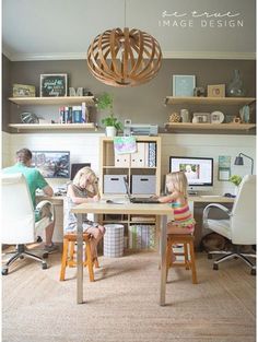 two people sitting at a desk in an office