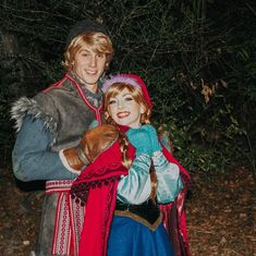 a man and woman dressed up in costumes