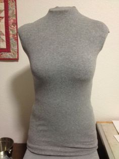 a woman's gray top is on display