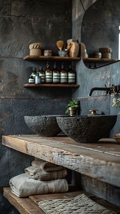 a rustic bathroom with stone sinks and wooden shelves