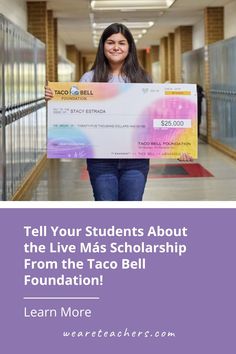 a woman holding a large cheque with the words tell your students about the live mass scholarship from the taco bell foundation