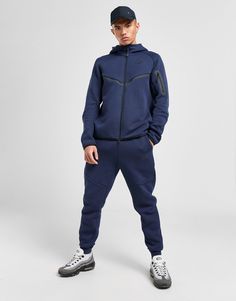 Make your street style stand out with these men's Tech Fleece Joggers from Nike. In an Obsidian colourway, these tapered joggers are cut from signature fleece fabric that's lightweight and warm and looks premium. They feature a drawcord-adjustable waistband, cuffed hems and articulated seams, while the Tech pocket zips in your essentials. Finished off with a tonal Nike Futura badge to the left thigh. Machine washable. | Our model is 6'0" and wears a size medium. Blue Nike Tech Fleece, Nike Tech Tracksuit, Nike Fleece Joggers, Blue Nike Tech, Nike Tech Fleece Joggers, Tapered Joggers, Preppy Clothes, Nike Tech Fleece, Nike Tech