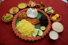 an assortment of different foods are arranged on a plate with sauces and condiments