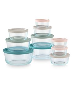 glass containers with lids are stacked on top of each other