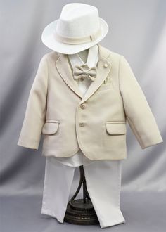 A charming choice for a Baptism outfit and formal wear for a boy. This baptismal outfit features a crisp white button-up shirt paired with tailored pants. A tan blazer, adorned with white enamel buttons, cuff-links, and pins embellished with gold accents, adds a touch of sophistication to this ensemble. Coordinating fedora, bow-tie, and belt are included. Elastic waistband for easy changing. Offered in a 12-18 Month size only. Ideal for wearing after the baptism at church, holidays, weddings, an Diy Sale, Baptism Outfit, Baptism Candle, Tan Blazer, Rhinestone Crown, Baptism Girl, White Button Up, Tailored Pants, Cuff Links